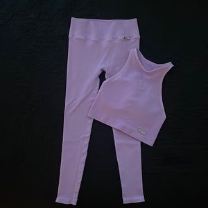 Workout set. Top/medium and bottoms/small size. A few snags noted on photos.